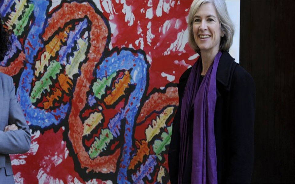 Image of Jennifer Doudna in front of wall art