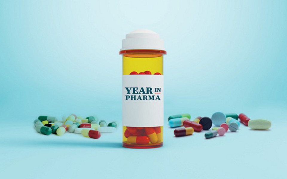 Image of pills laying around prescription bottle labeled 