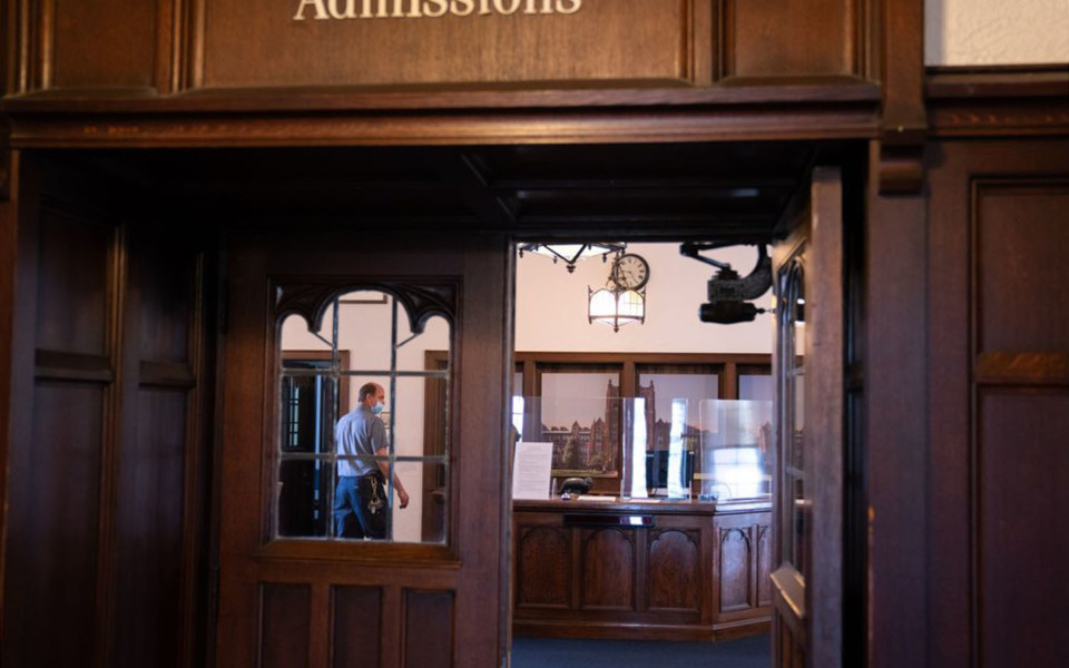 Bloomberg news coronavirus universities header Image of plexiglass guards at Notre Dame College